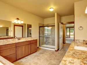Image of a a bathroom with tan granite counters