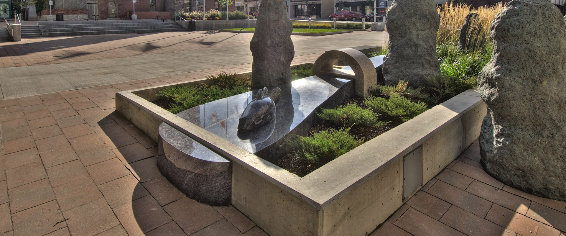 Polished granite art elements from the Indigena Domain project at Cambridge City Hall