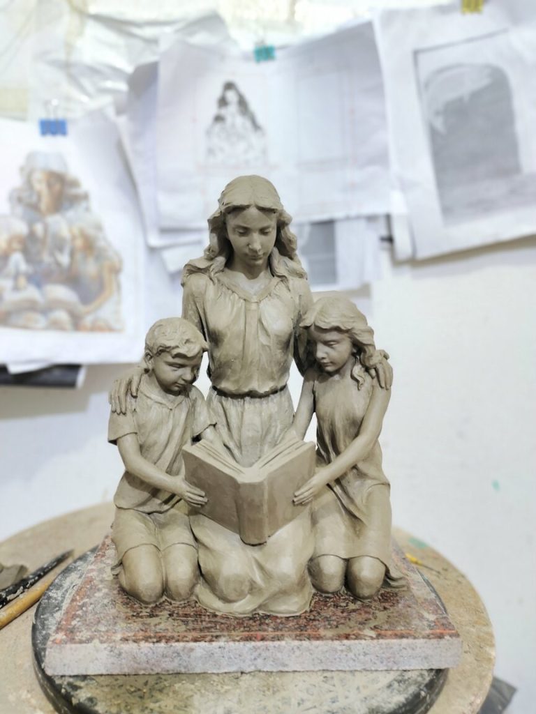 granite sculpture of mother and children