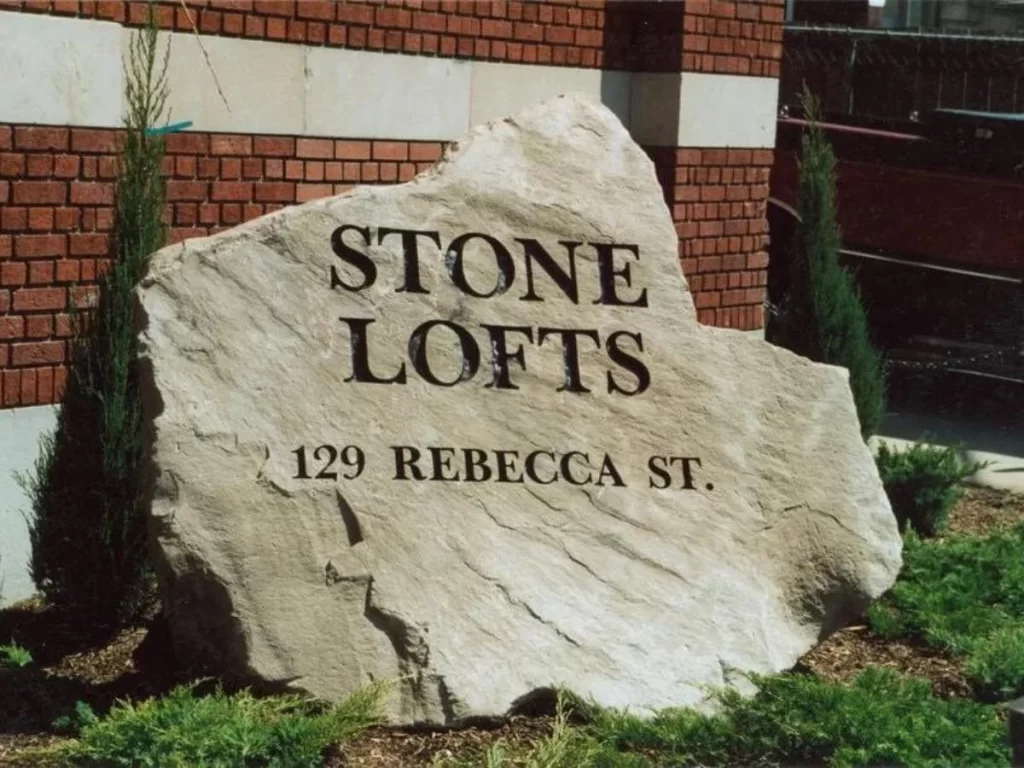 stone lofts business logo on rock