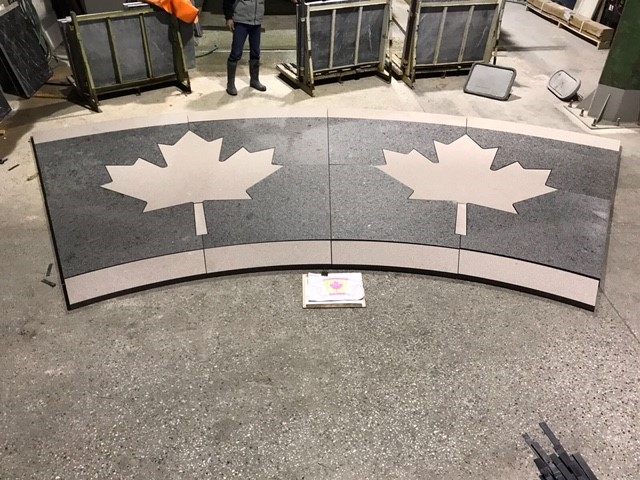 Custom granite pavers with Canadian Maple Leaf