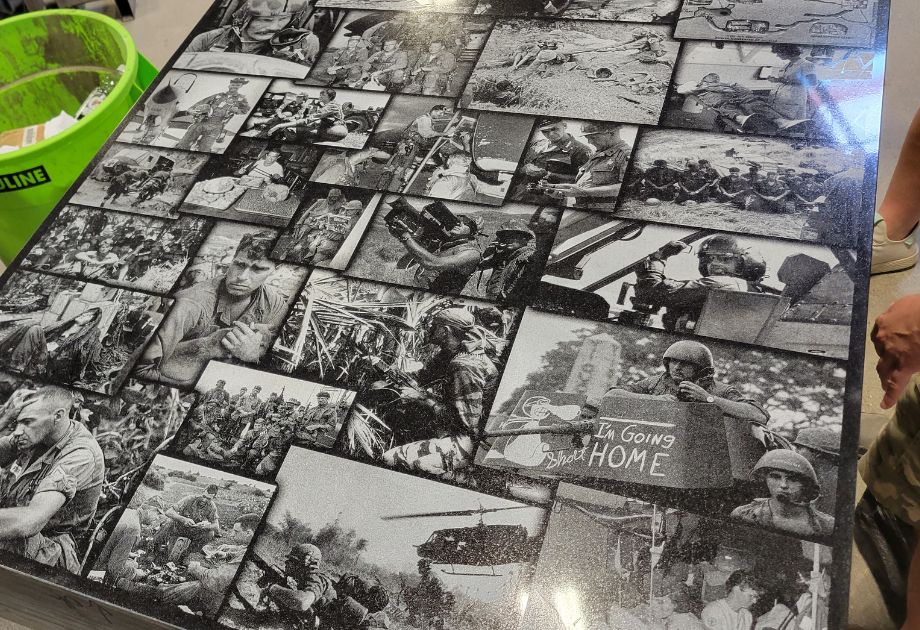 Lasered war memorial images on granite
