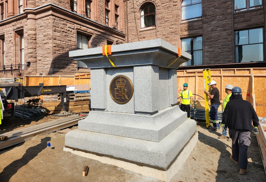 Granite base being installed for the Queen Elizabeth statue